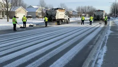 Professional de-icing and salt application on pavement by Chop Chop Landscaping in Naperville, IL